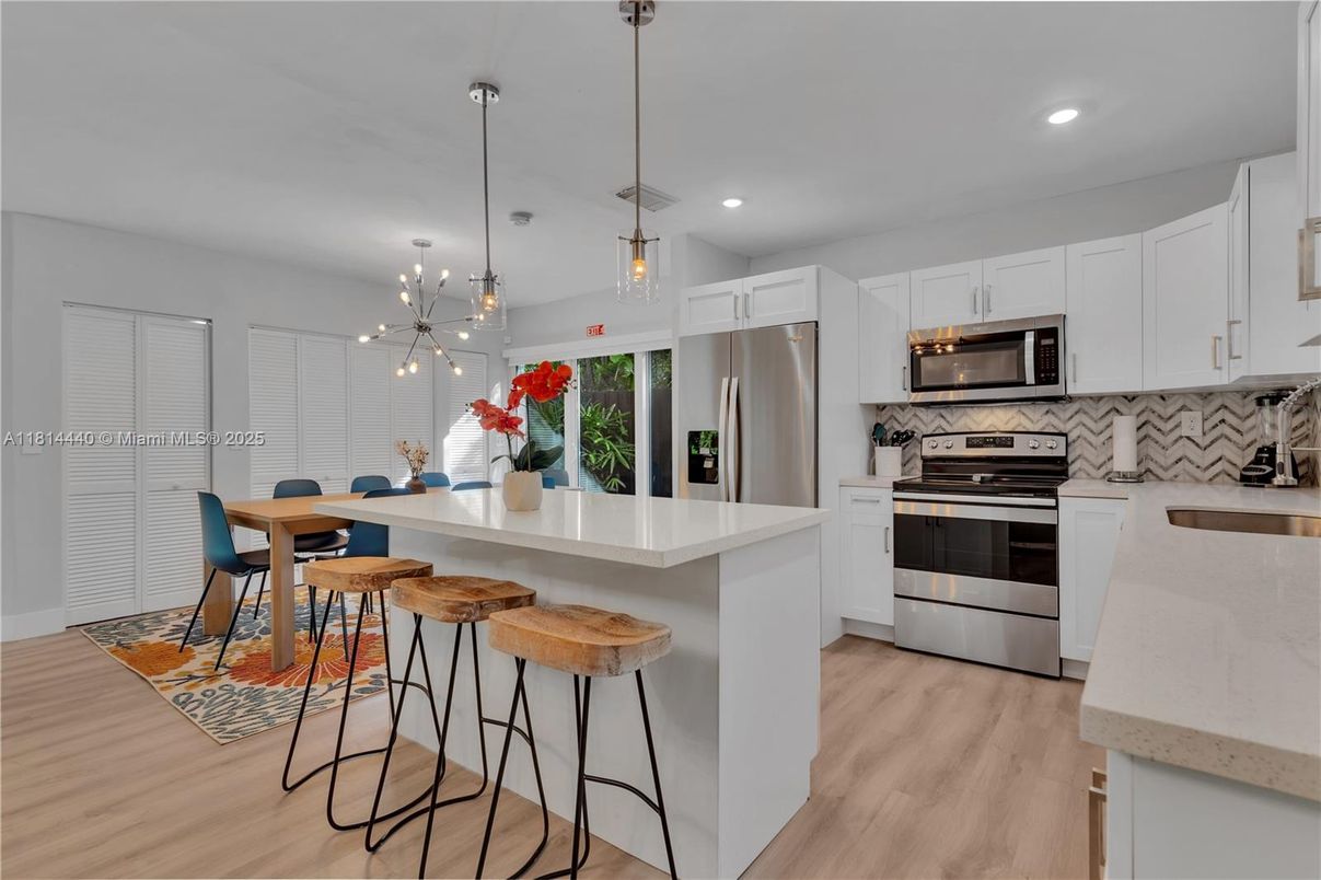 Dining room, Interior, Kitchen, Pendant Lights, Recessed Lighting, Stainless Steel Appliances, Wood Texture Flooring