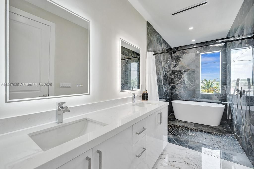 Bathroom, Dual Sink Vanities, Free Standing Baths, Interior, Marble, Marble Walls, Recessed Lighting