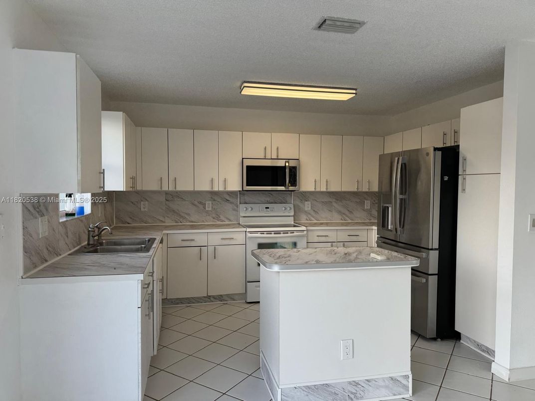 Interior, Kitchen, Marble, Marble Walls, Stainless Steel Appliances