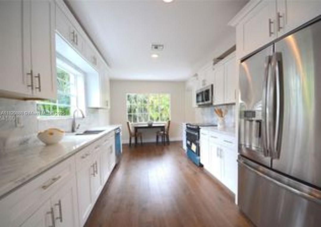 Dining room, Interior, Kitchen, Recessed Lighting, Stainless Steel Appliances, Wood Texture Flooring
