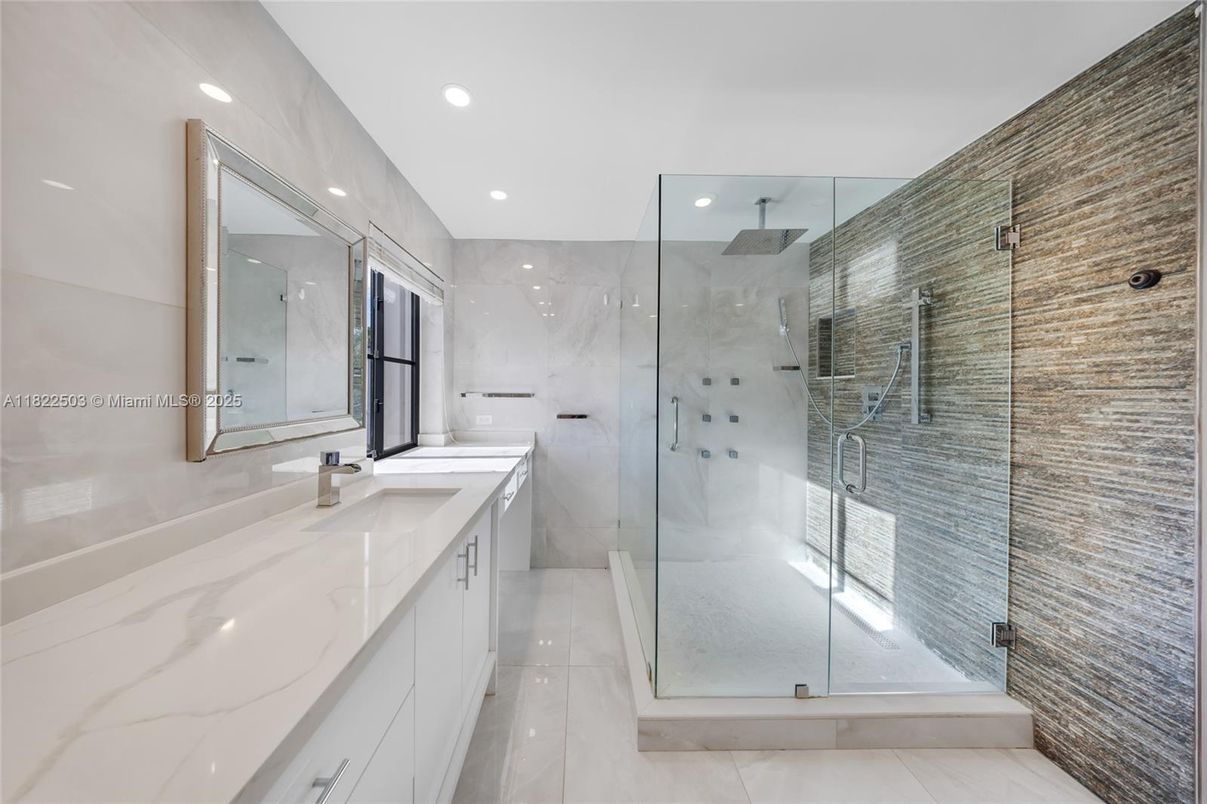 Bathroom, Dual Sink Vanities, Glass Shower, Interior, Marble Walls, Recessed Lighting