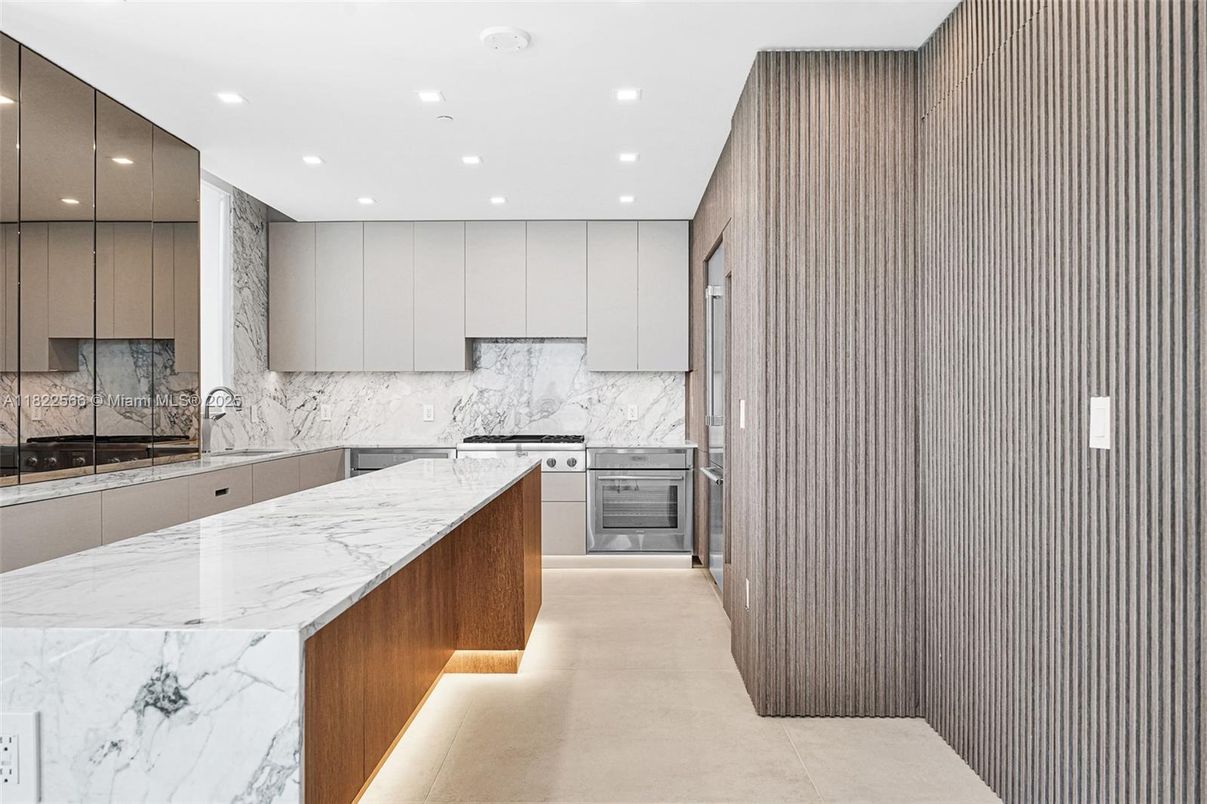 Interior, Kitchen, Marble Walls, Recessed Lighting, Stainless Steel Appliances
