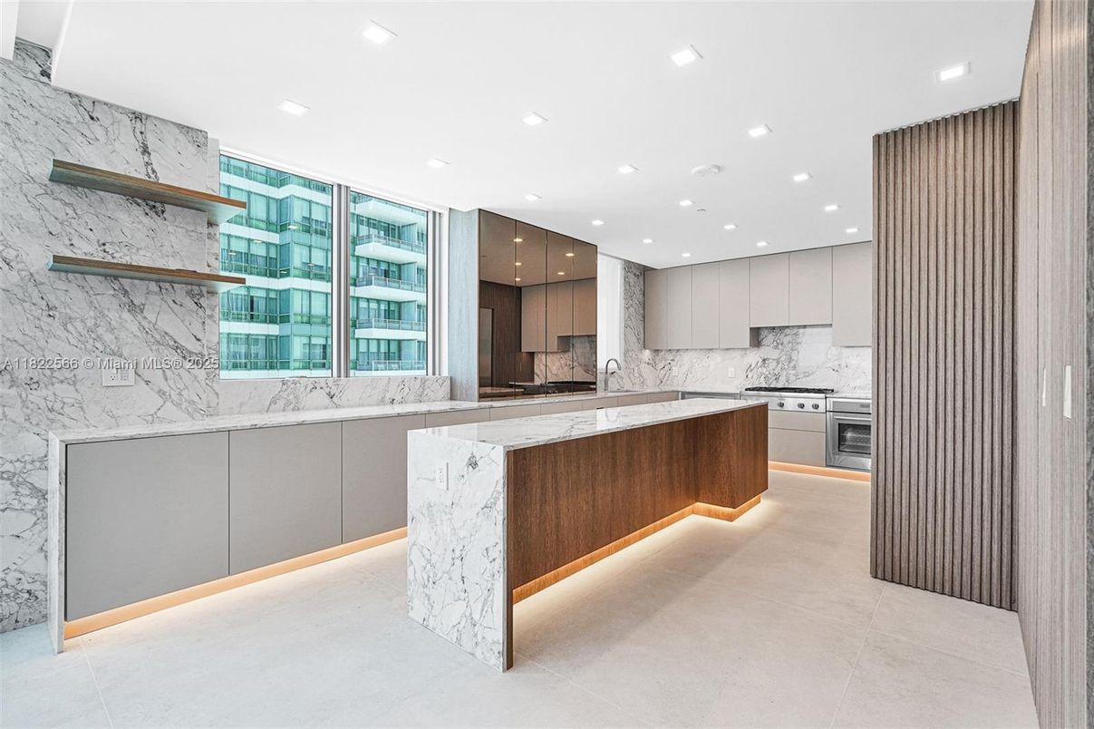 Interior, Kitchen, Marble Walls, Recessed Lighting, Stainless Steel Appliances