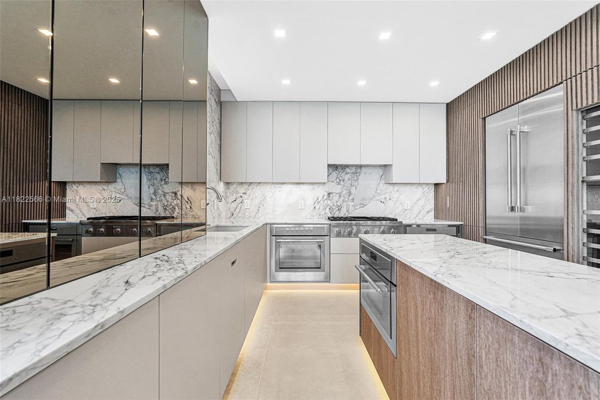 Interior, Kitchen, Marble Walls, Recessed Lighting, Stainless Steel Appliances