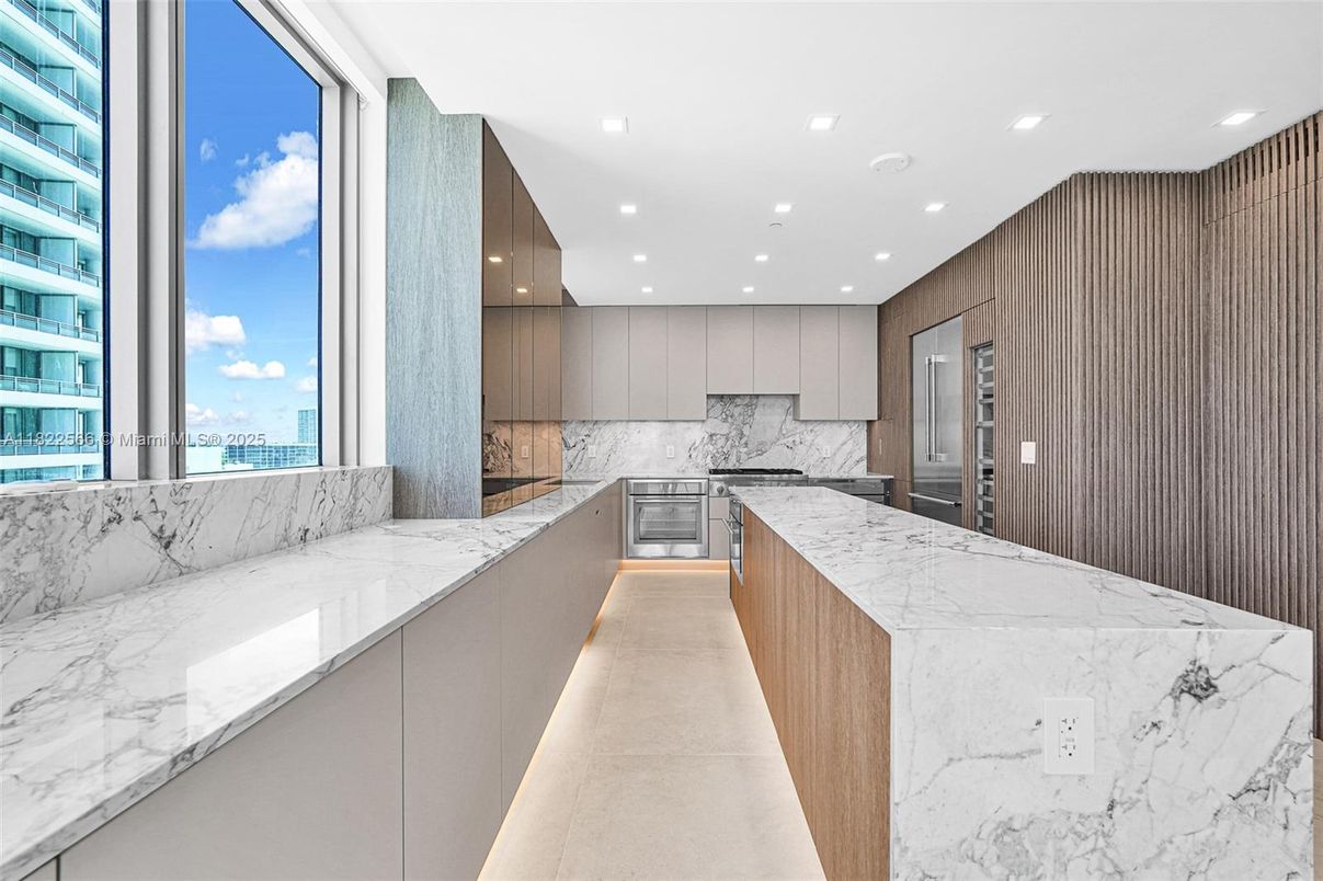 Interior, Kitchen, Marble Walls, Recessed Lighting, Stainless Steel Appliances