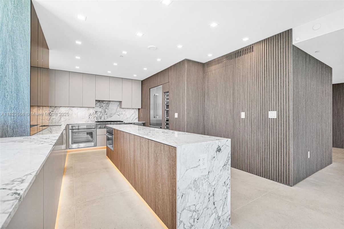 Interior, Kitchen, Marble Walls, Recessed Lighting, Stainless Steel Appliances