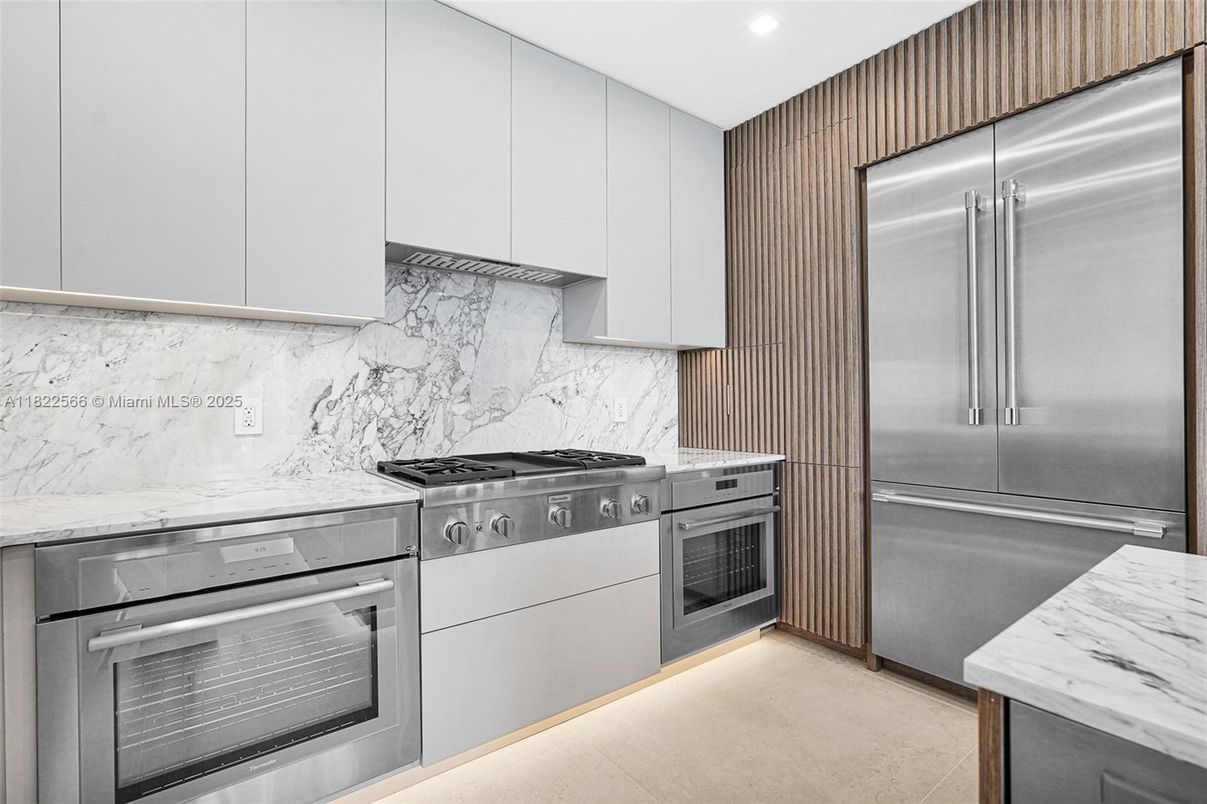 Interior, Kitchen, Marble Walls, Recessed Lighting, Stainless Steel Appliances