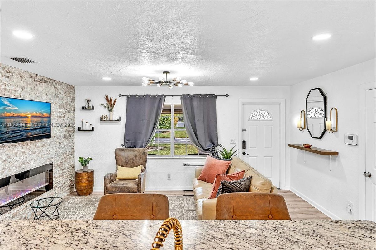 Fireplace, Interior, Living room, Recessed Lighting, Stone Walls, Wood Texture Flooring
