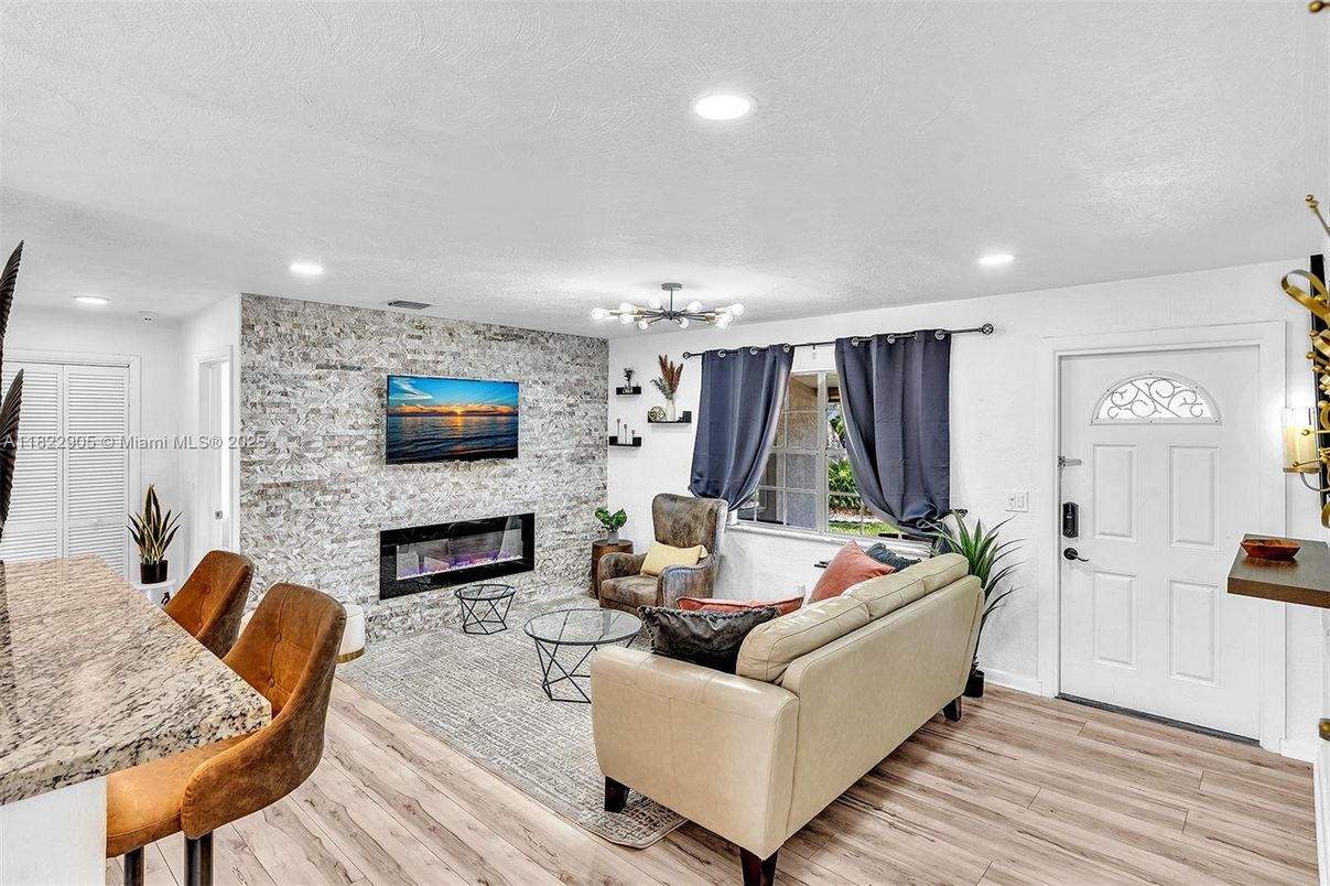 Fireplace, Interior, Living room, Recessed Lighting, Stone Walls, Wood Texture Flooring