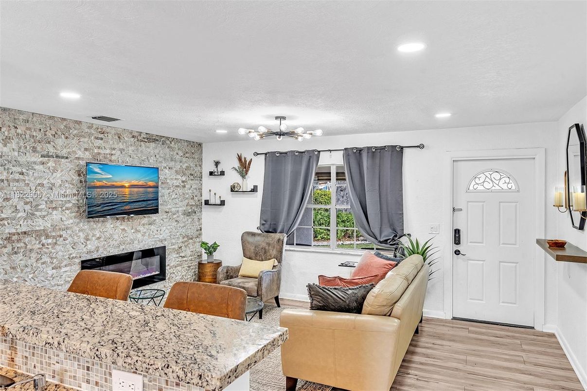 Fireplace, Interior, Living room, Recessed Lighting, Stone Walls, Wood Texture Flooring