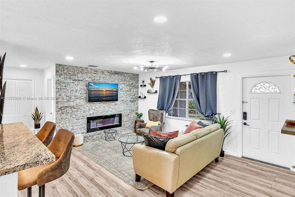 Fireplace, Interior, Living room, Recessed Lighting, Stone Walls, Wood Texture Flooring