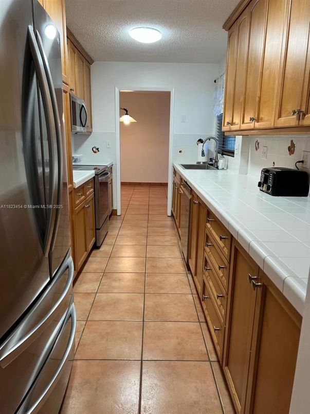 Interior, Kitchen, Recessed Lighting, Tile Countertops