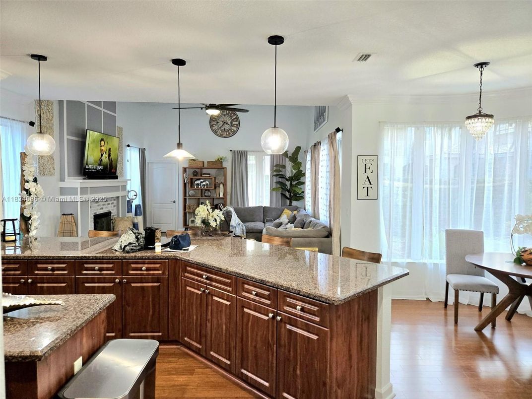 Dining room, Fireplace, Interior, Living room, Pendant Lights, Wood Texture Flooring