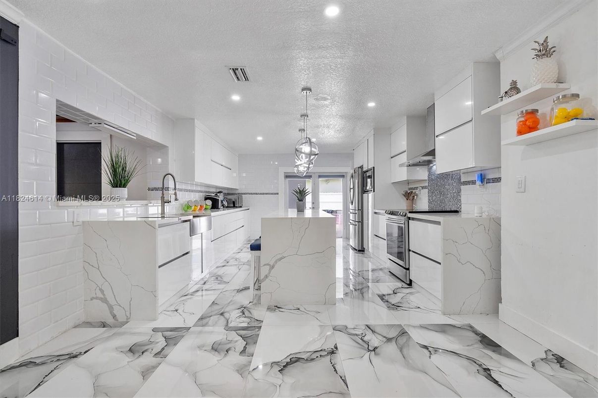 Interior, Kitchen, Marble, Marble Walls, Pendant Lights, Recessed Lighting, Stainless Steel Appliances
