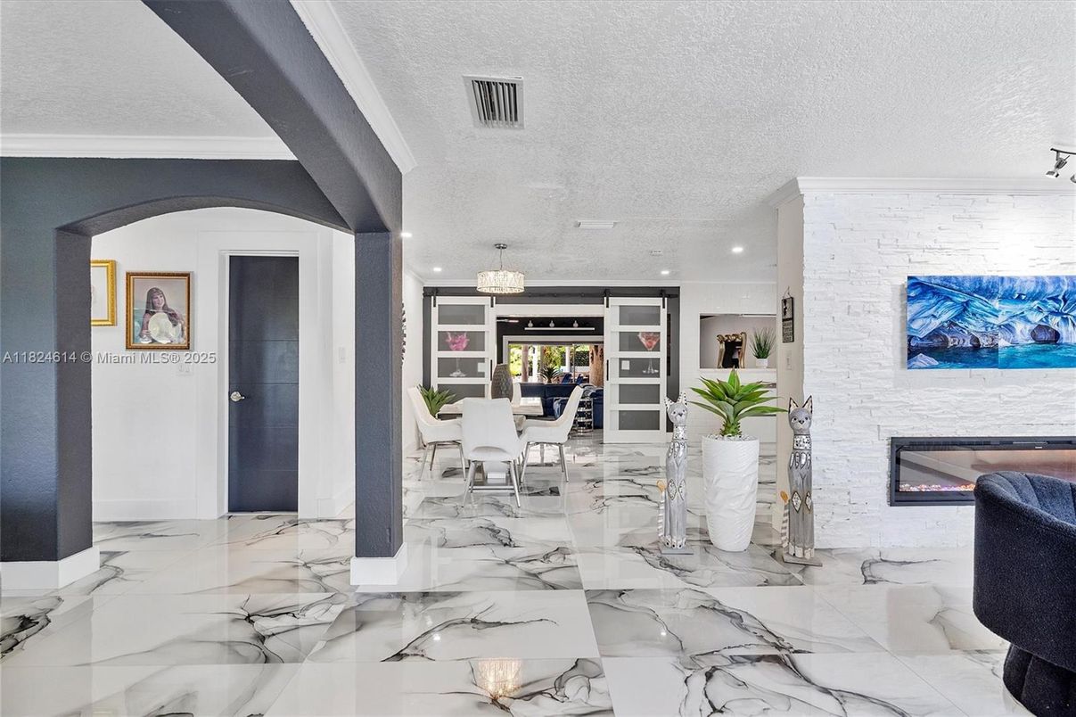 Dining room, Fireplace, Interior, Living room, Marble, Recessed Lighting, Stone Walls