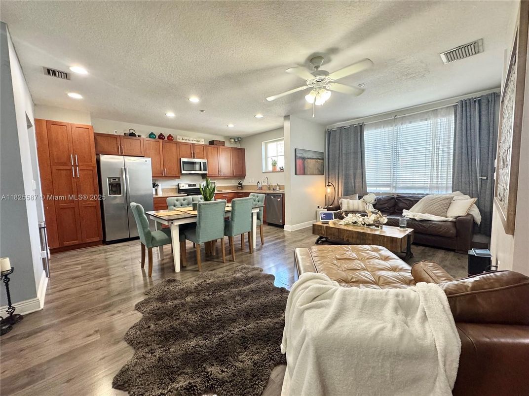 Dining room, Interior, Kitchen, Living room, Recessed Lighting, Stainless Steel Appliances, Wood Texture Flooring