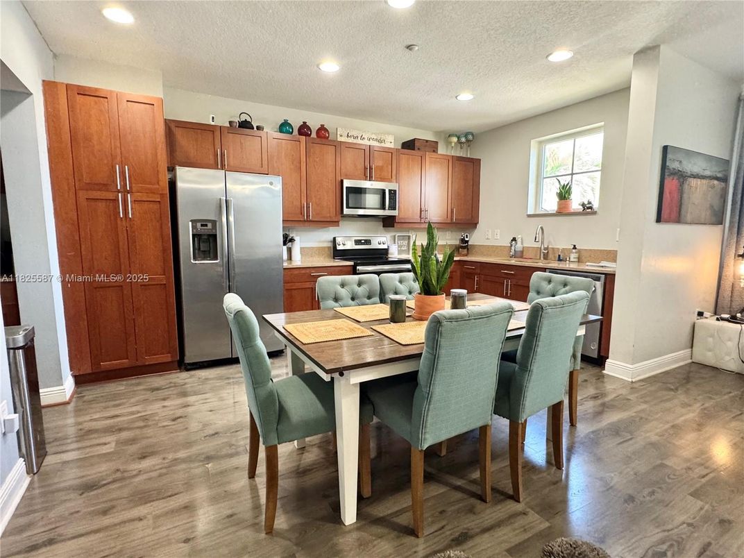 Dining room, Interior, Kitchen, Recessed Lighting, Stainless Steel Appliances, Wood Texture Flooring