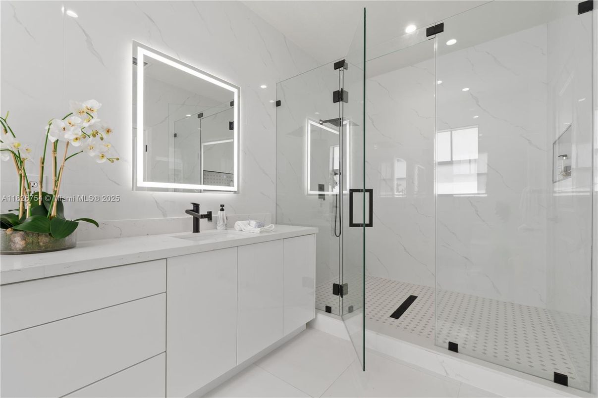 Bathroom, Dual Sink Vanities, Glass Shower, Interior, Marble Walls, Recessed Lighting
