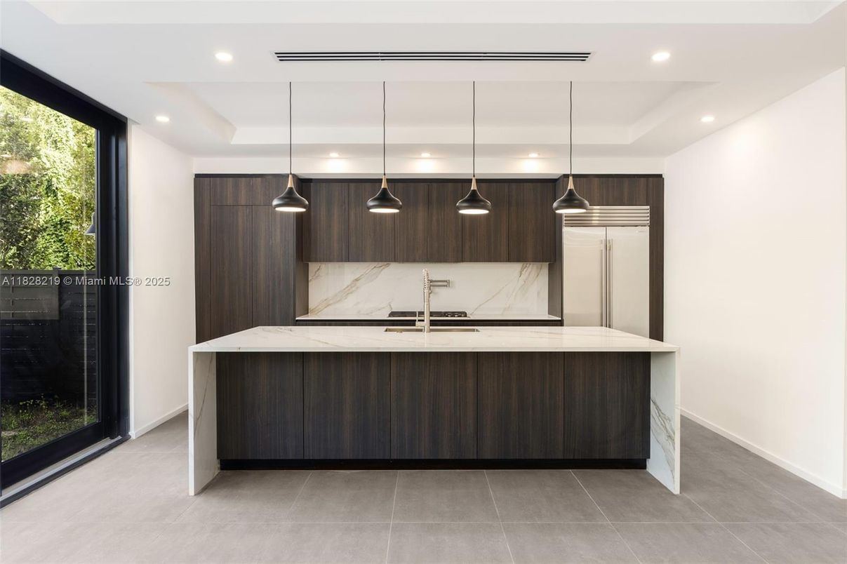 Interior, Kitchen, Marble Walls, Pendant Lights, Recessed Lighting, Stainless Steel Appliances