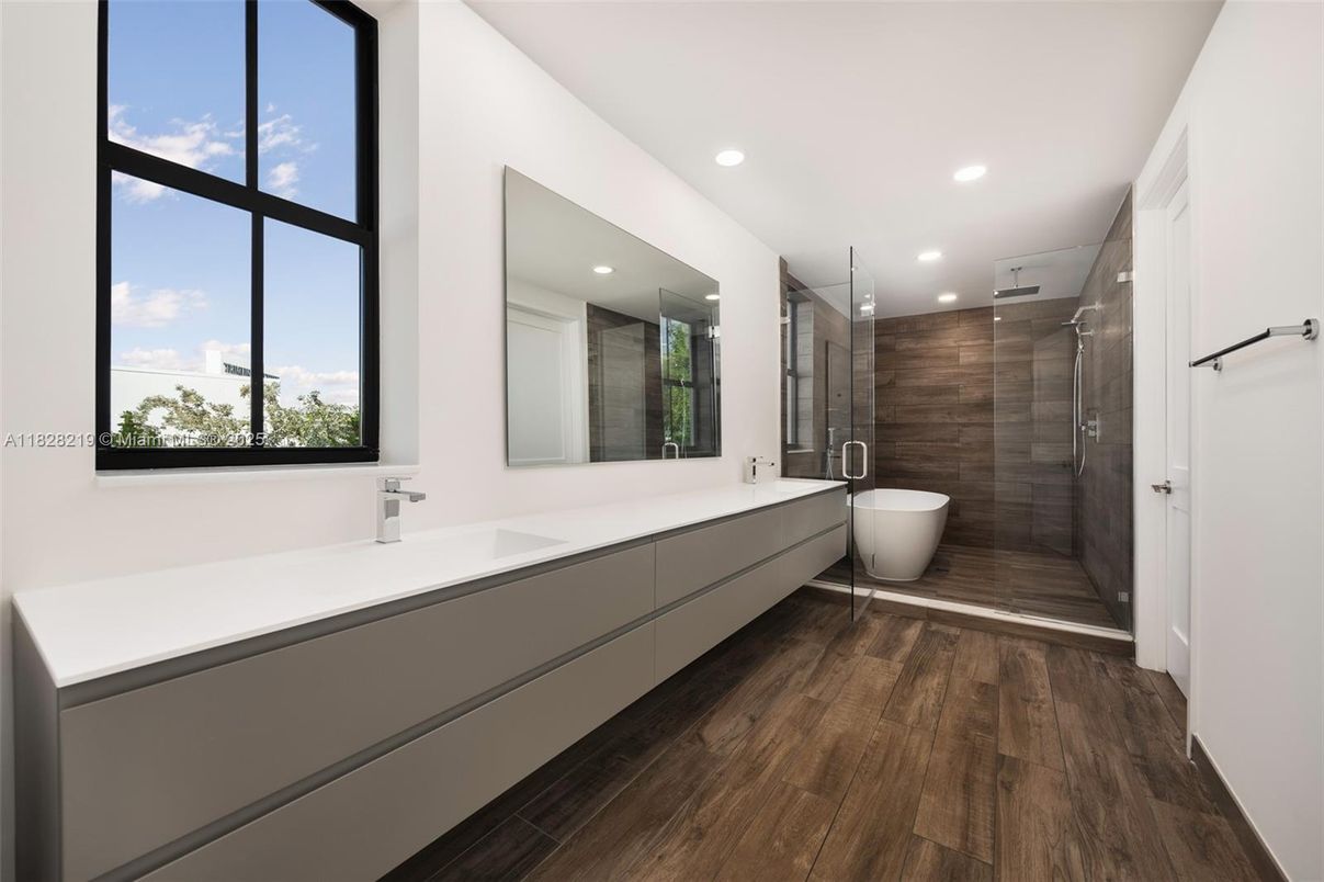 Bathroom, Dual Sink Vanities, Free Standing Baths, Glass Shower, Interior, Recessed Lighting, Wood Texture Flooring