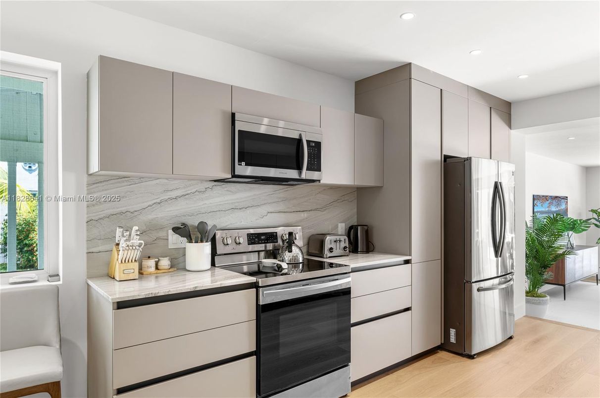 Interior, Kitchen, Marble Walls, Recessed Lighting, Stainless Steel Appliances, Wood Texture Flooring