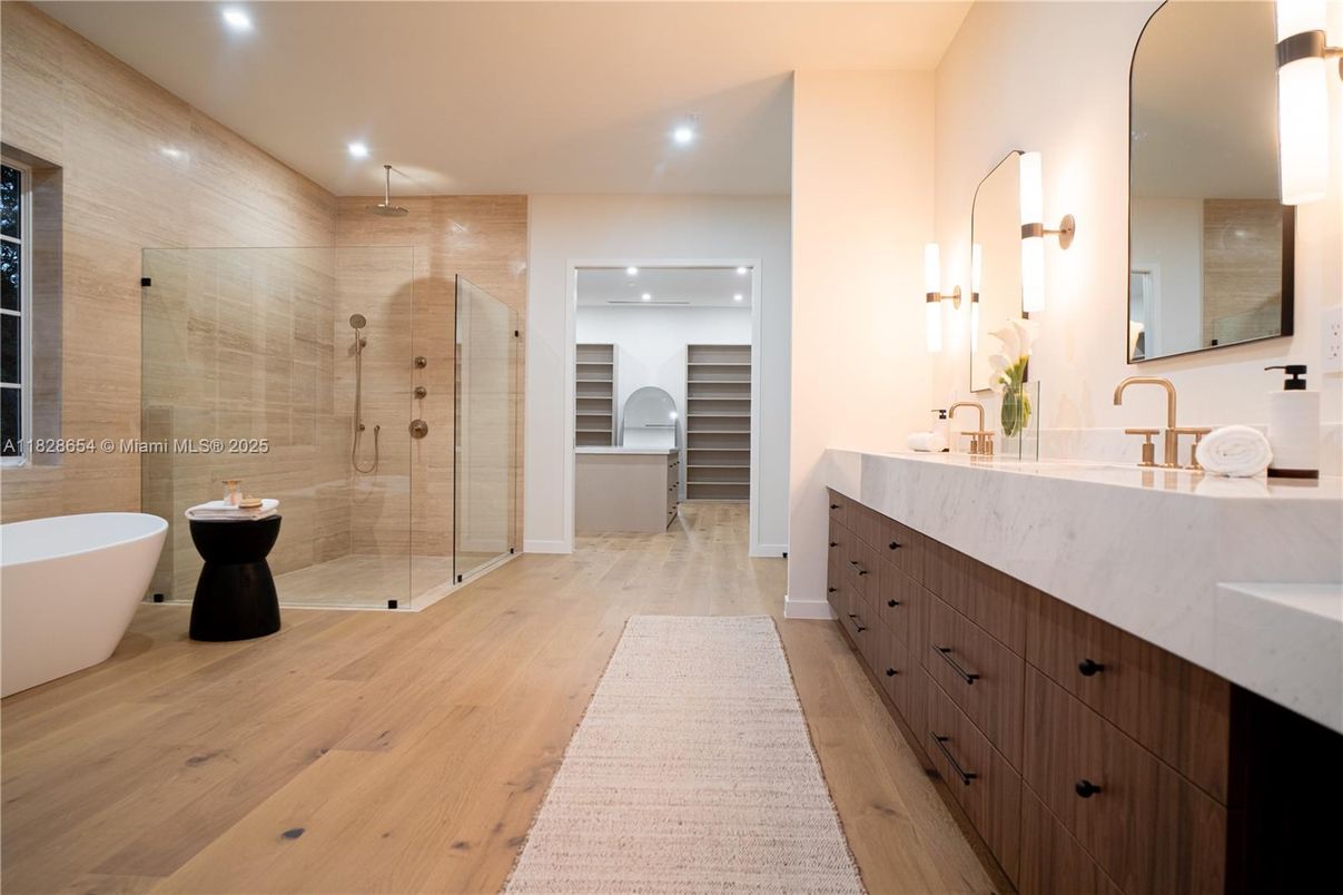 Bathroom, Dual Sink Vanities, Free Standing Baths, Glass Shower, Interior, Recessed Lighting, Walk-in Closets, Wood Texture Flooring