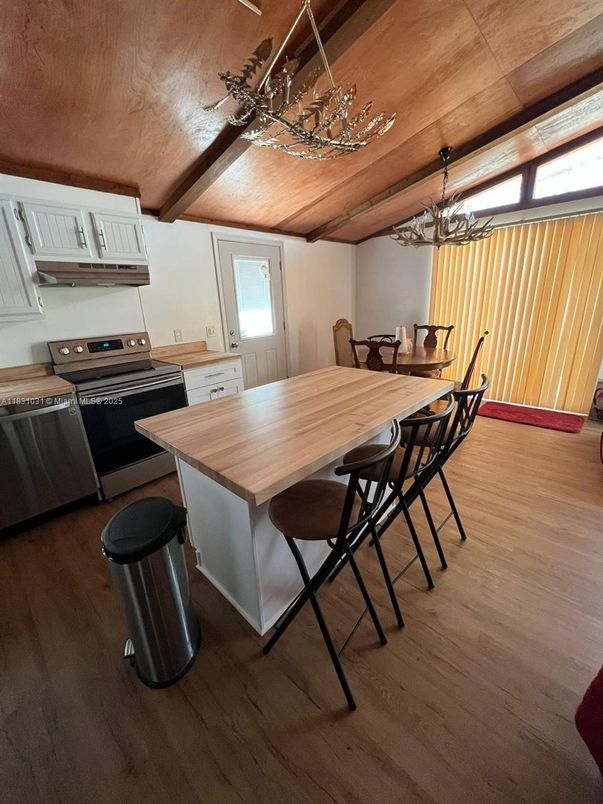 Chandelier, Dining room, Interior, Kitchen, Stainless Steel Appliances, Wooden Ceilings, Wood Texture Flooring