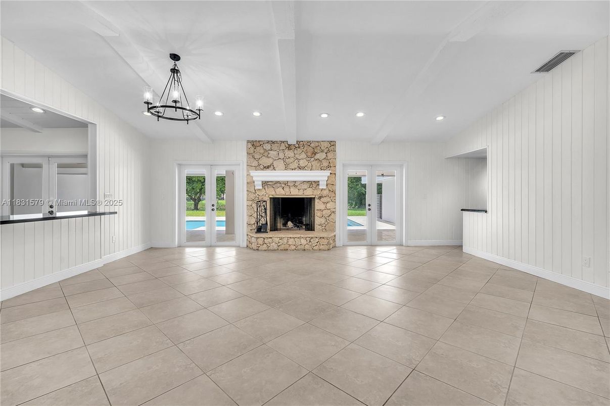 Chandelier, Empty room, Fireplace, Interior, Recessed Lighting, Stone Walls