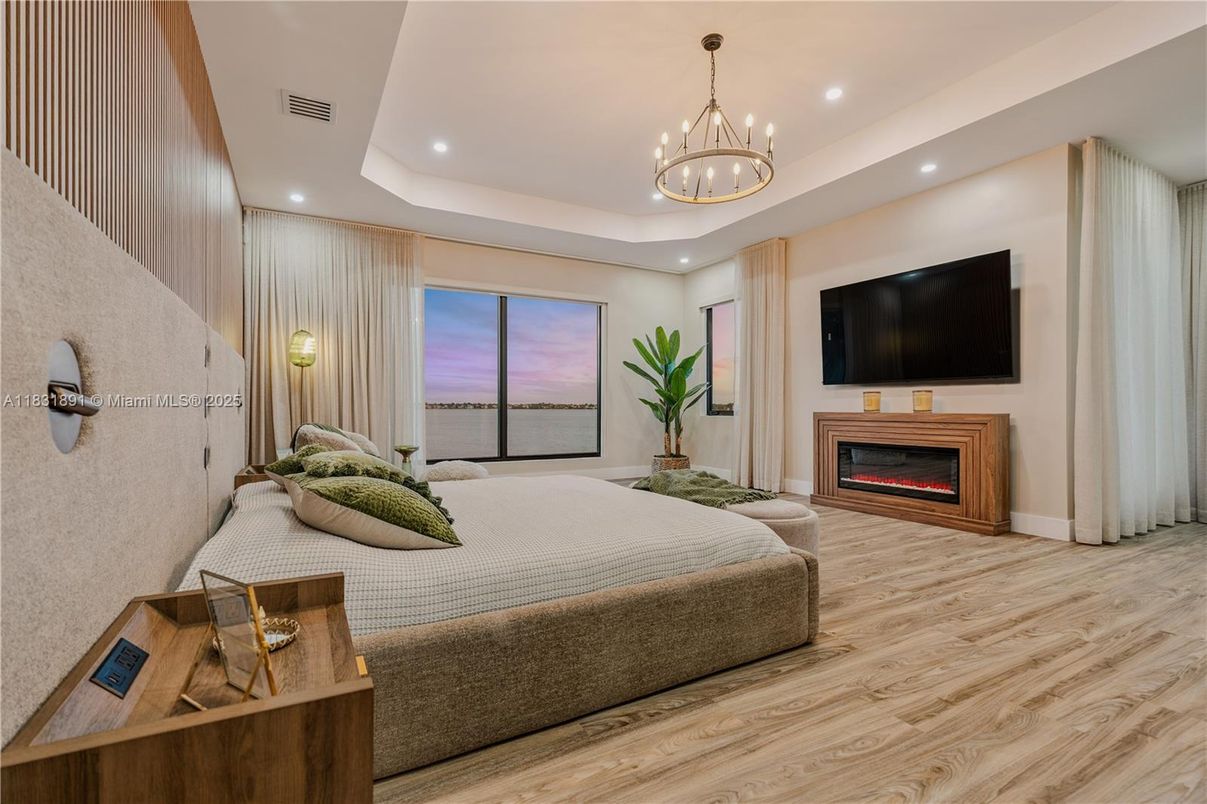 Bedroom, Chandelier, Fireplace, Interior, Recessed Lighting, Wood Texture Flooring