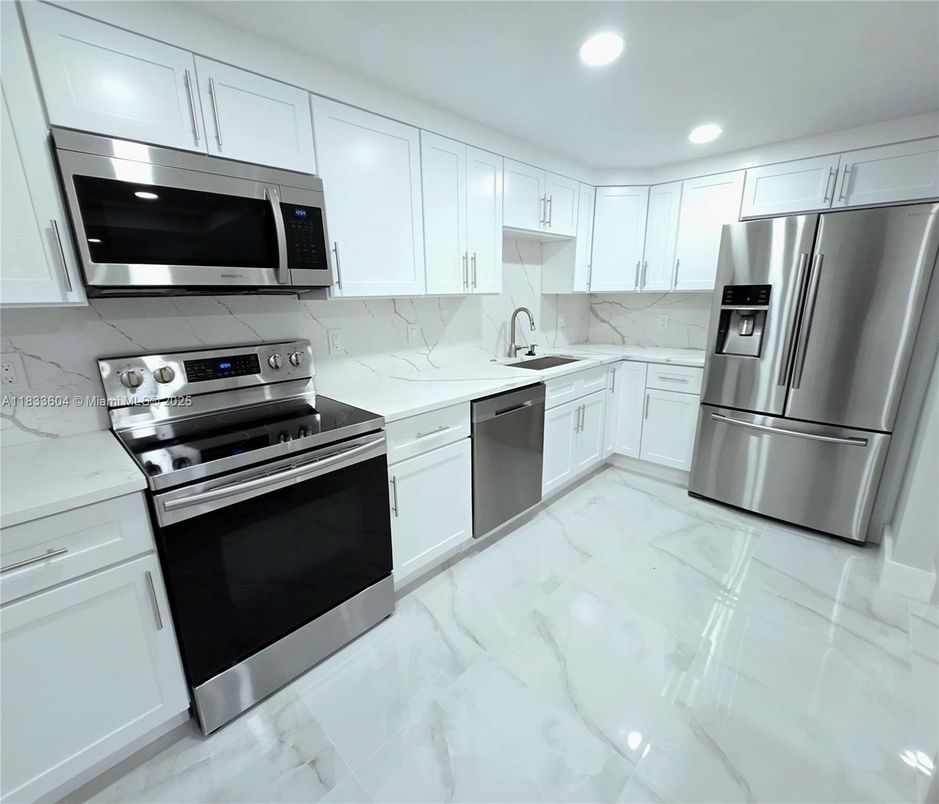 Interior, Kitchen, Marble, Marble Walls, Recessed Lighting, Stainless Steel Appliances