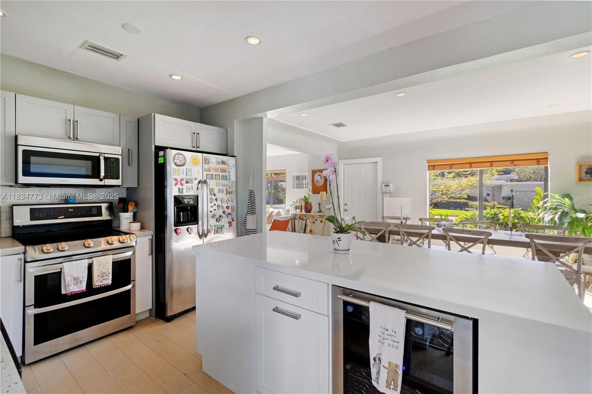 Dining room, Interior, Kitchen, Recessed Lighting, Stainless Steel Appliances, Wood Texture Flooring