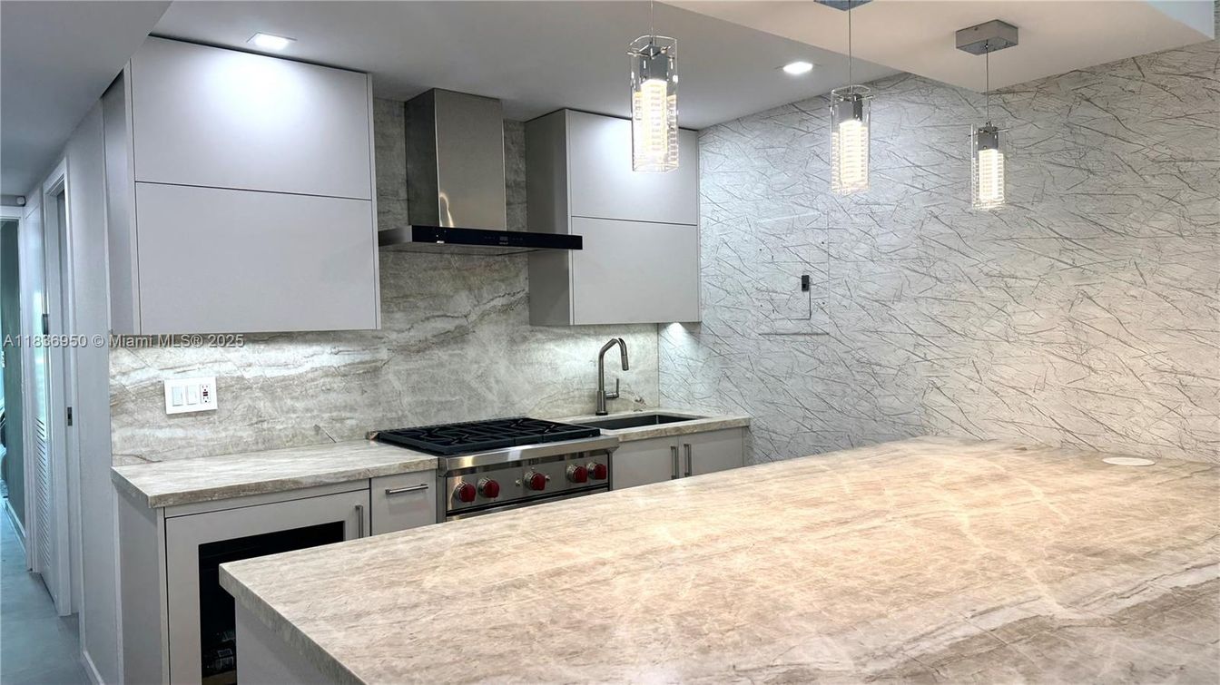 Interior, Kitchen, Marble Walls, Pendant Lights, Recessed Lighting, Stainless Steel Appliances
