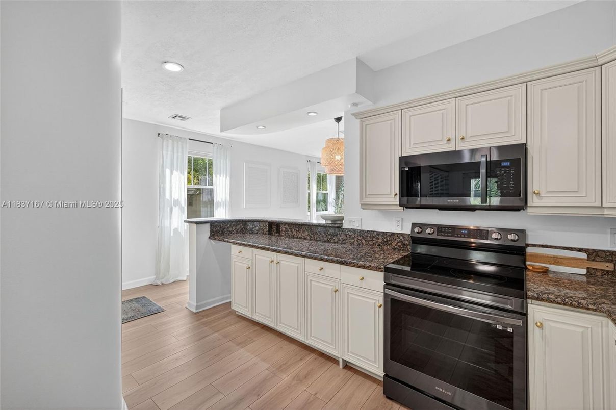 Chandelier, Interior, Kitchen, Recessed Lighting, Stainless Steel Appliances, Wood Texture Flooring