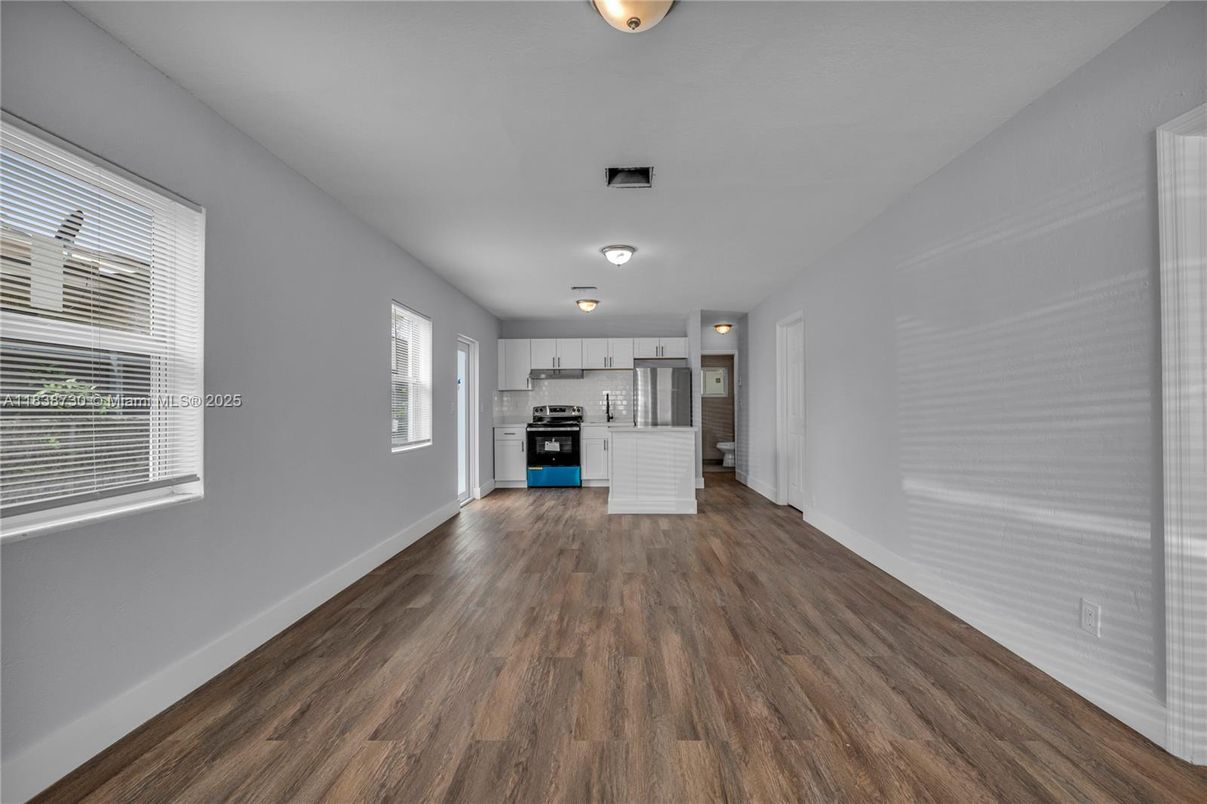 Empty room, Interior, Kitchen, Stainless Steel Appliances, Wood Texture Flooring
