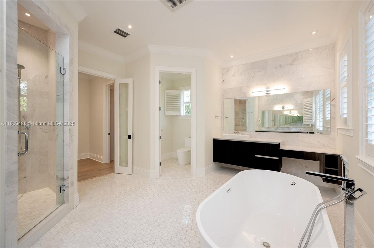 Bathroom, Dual Sink Vanities, Free Standing Baths, Glass Shower, Interior, Marble Walls, Recessed Lighting