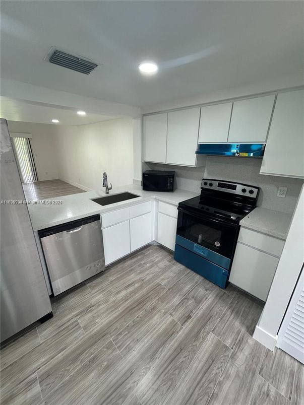 Interior, Kitchen, Recessed Lighting, Stainless Steel Appliances, Wood Texture Flooring