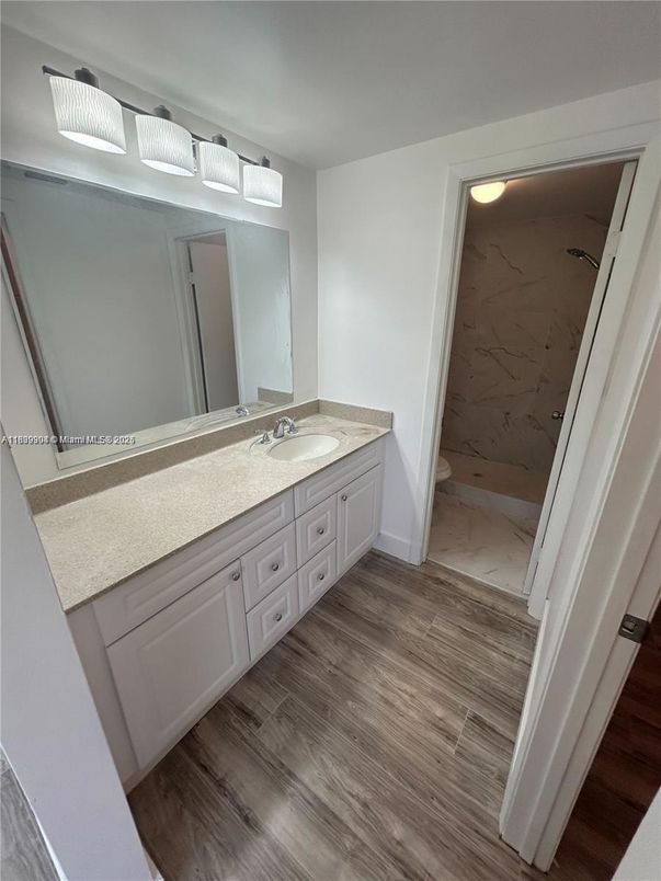 Bathroom, Dual Sink Vanities, Interior, Marble, Marble Walls, Wood Texture Flooring