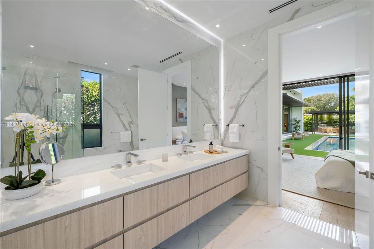 Bathroom, Dual Sink Vanities, Glass Shower, Interior, Marble, Marble Walls, Recessed Lighting, Wood Texture Flooring