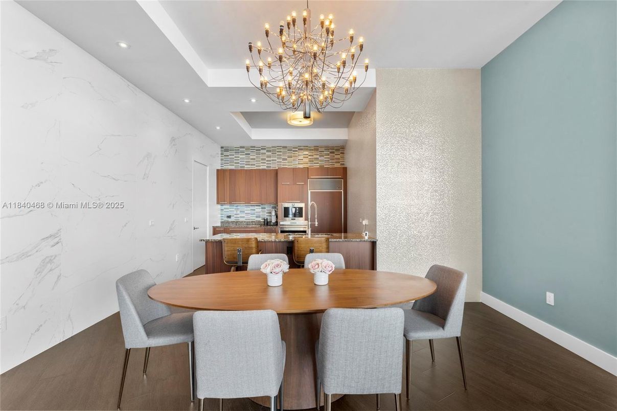Chandelier, Dining room, Interior, Kitchen, Marble Walls, Recessed Lighting, Stainless Steel Appliances, Wood Texture Flooring