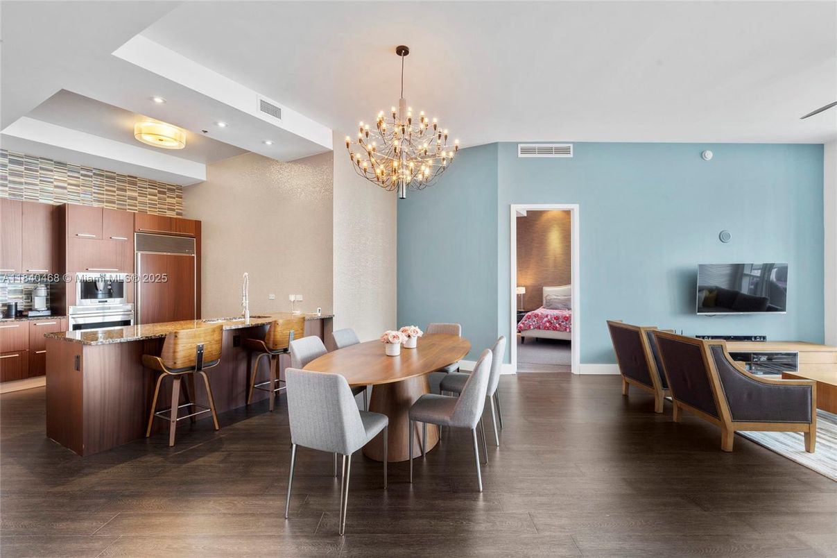 Chandelier, Dining room, Interior, Kitchen, Pendant Lights, Recessed Lighting, Stainless Steel Appliances, Wood Texture Flooring