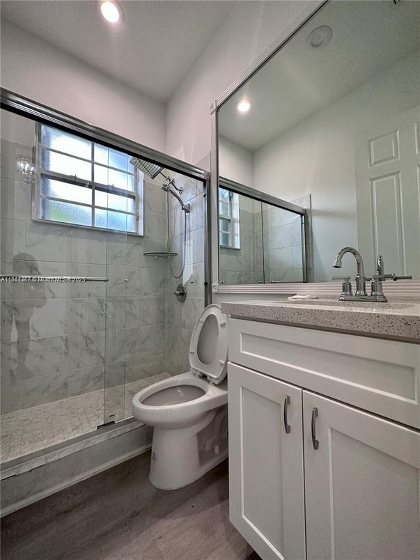 Bathroom, Glass Shower, Interior, Marble Walls, Recessed Lighting, Wood Texture Flooring