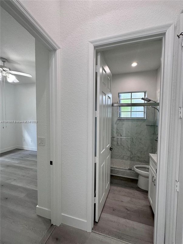 Bathroom, Interior, Marble Walls, Recessed Lighting, Wood Texture Flooring
