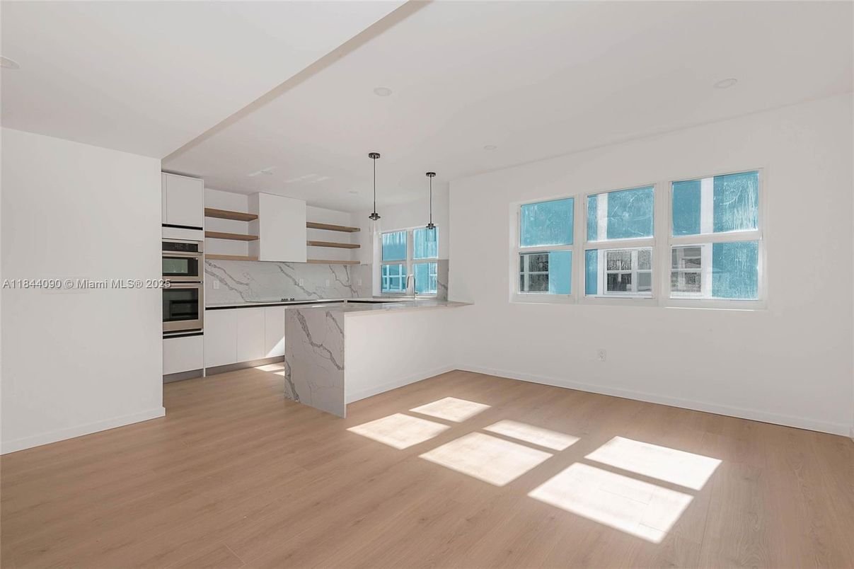 Interior, Kitchen, Marble Walls, Pendant Lights, Stainless Steel Appliances, Wood Texture Flooring