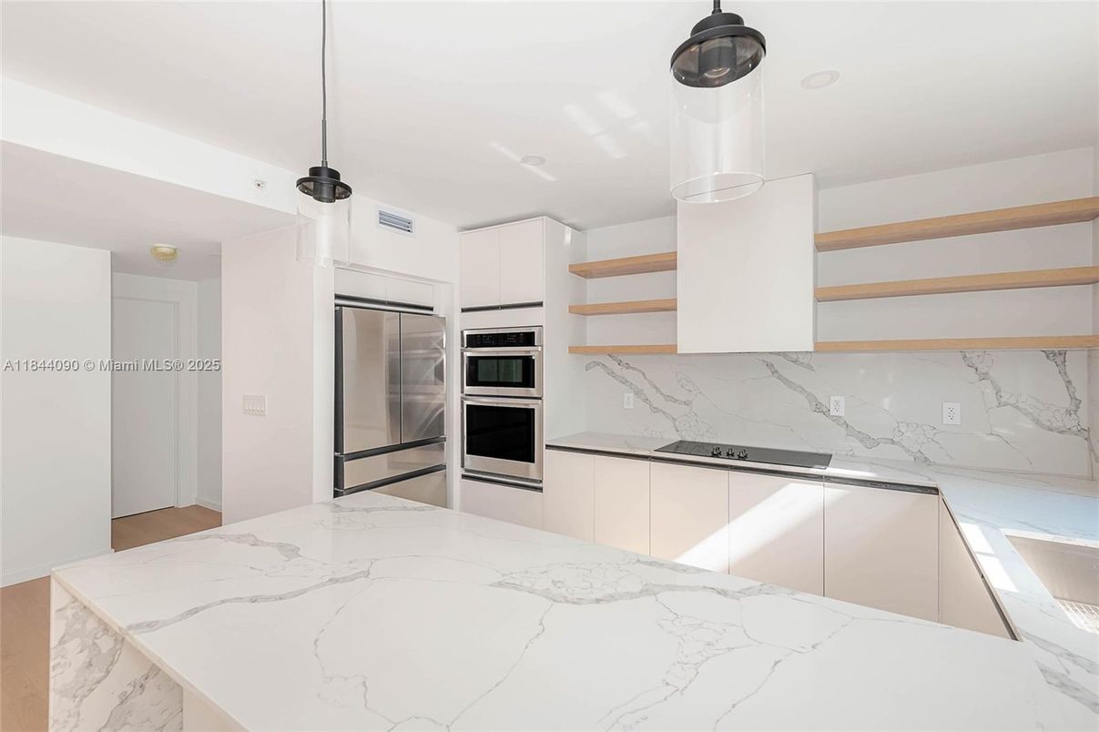 Interior, Kitchen, Marble Walls, Pendant Lights, Stainless Steel Appliances