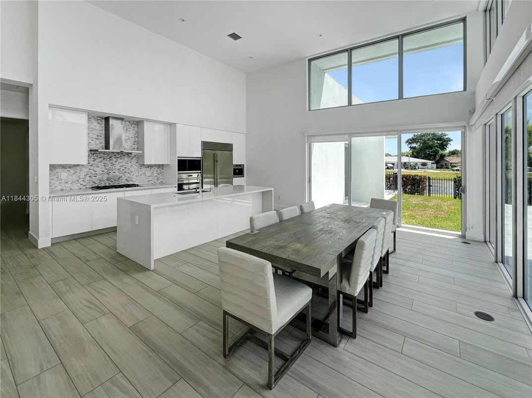 Dining room, Interior, Kitchen, Recessed Lighting, Stainless Steel Appliances, Wood Texture Flooring