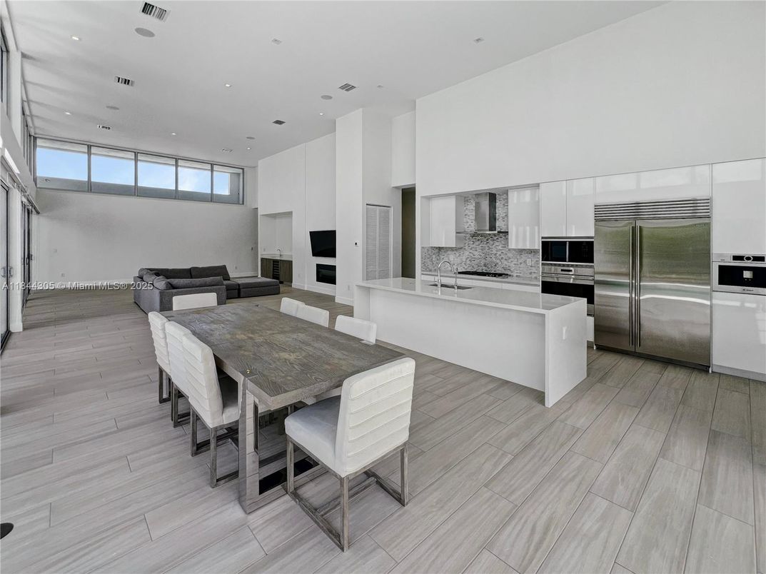 Dining room, Interior, Kitchen, Living room, Recessed Lighting, Stainless Steel Appliances, Wood Texture Flooring