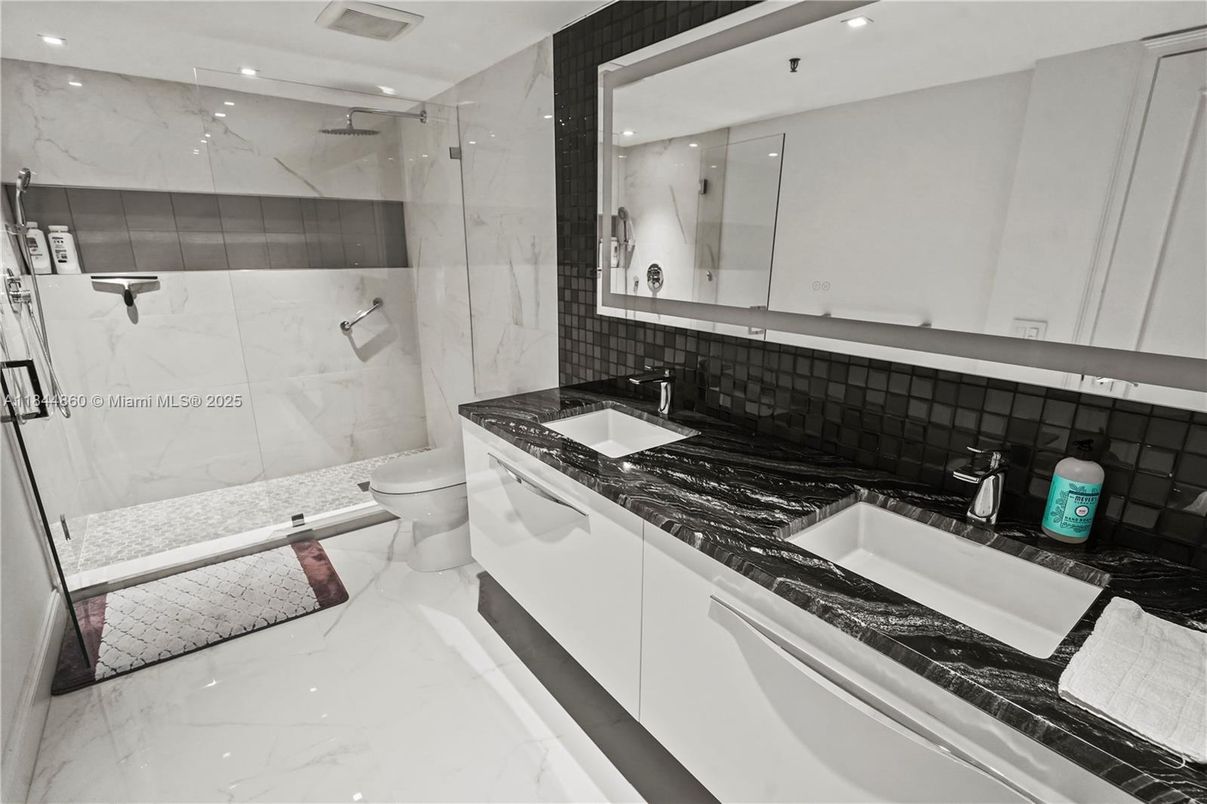 Bathroom, Dual Sink Vanities, Glass Shower, Interior, Marble, Marble Walls, Recessed Lighting