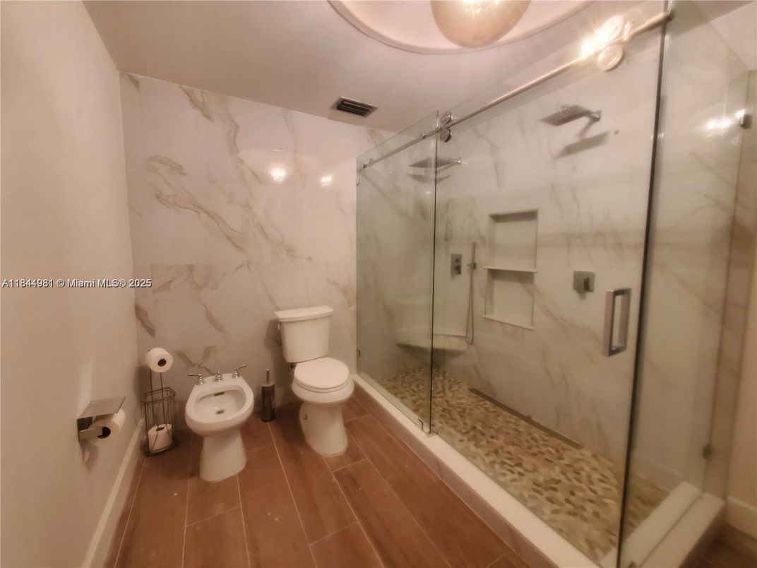 Bathroom, Glass Shower, Interior, Marble Walls, Wood Texture Flooring