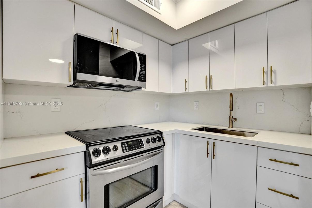 Interior, Kitchen, Marble Walls, Recessed Lighting, Stainless Steel Appliances