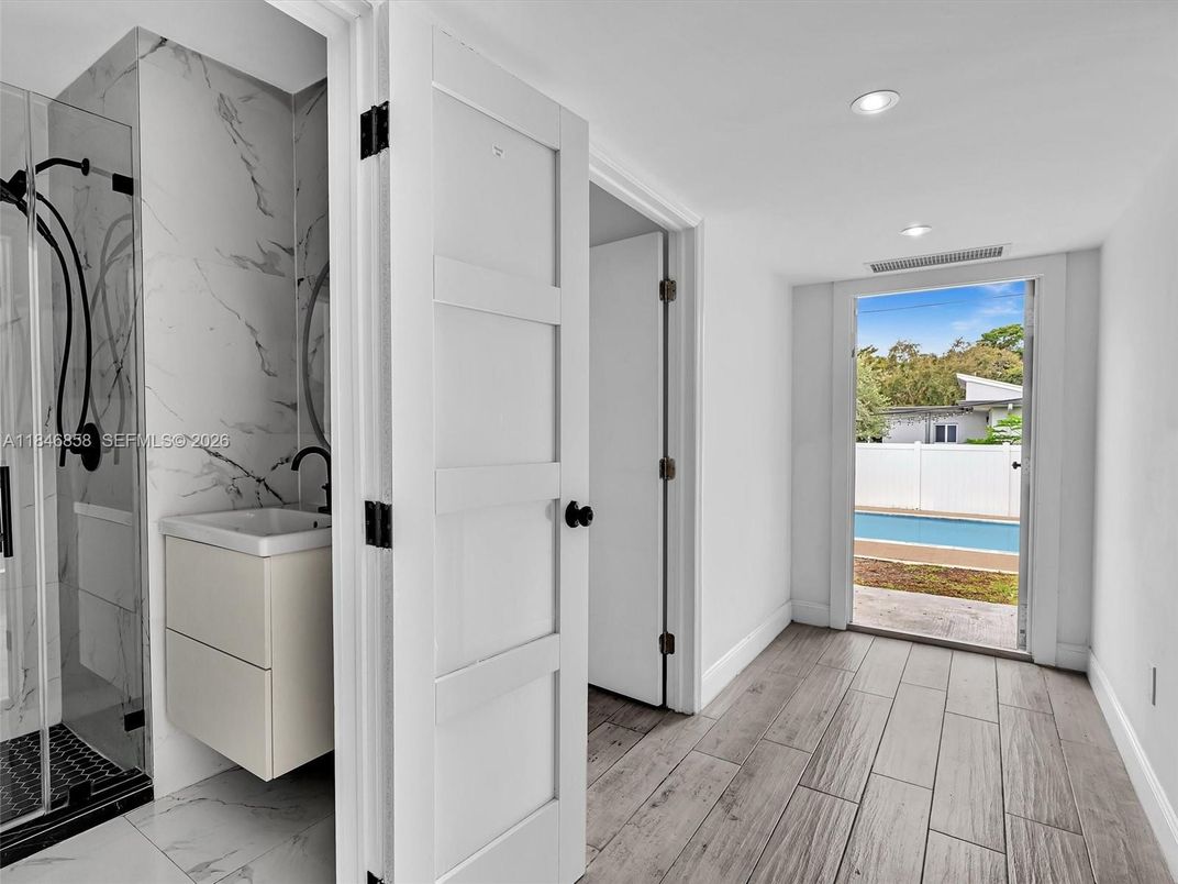 Interior, Marble, Marble Walls, Recessed Lighting, Utility Closets, Washer, Wood Texture Flooring